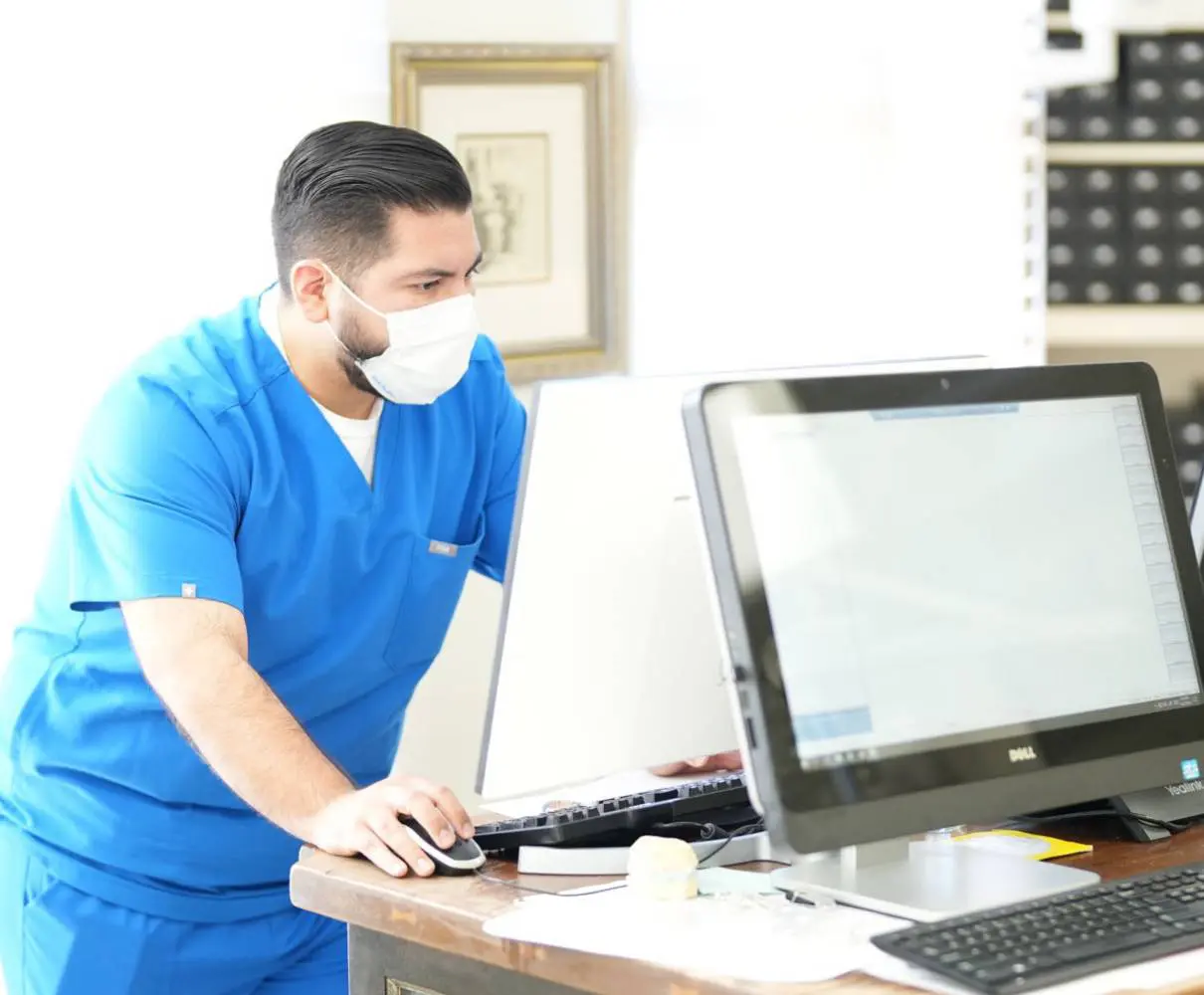 Orthodontic Center LA staff looking at computer